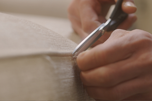 Craftsman hand-stitching chair upholstery